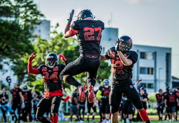 What strategies can be used to enhance team cohesion in sports teams?